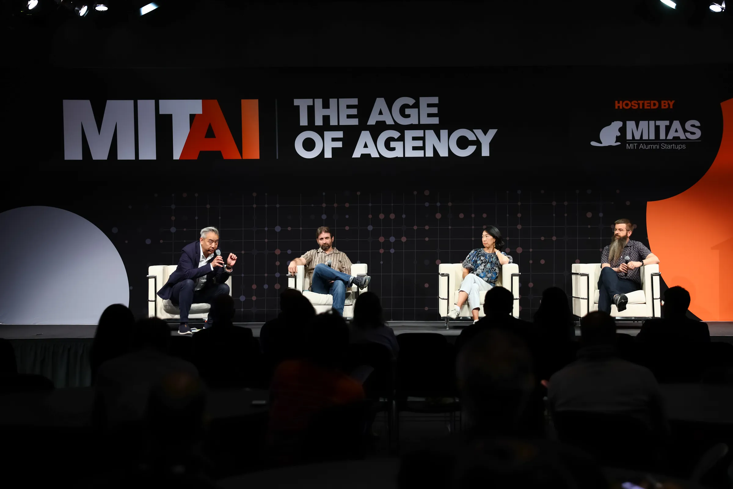 Justin McCarthy, far right, on the Age of Agency panel at MIT AI, speaking to a full room